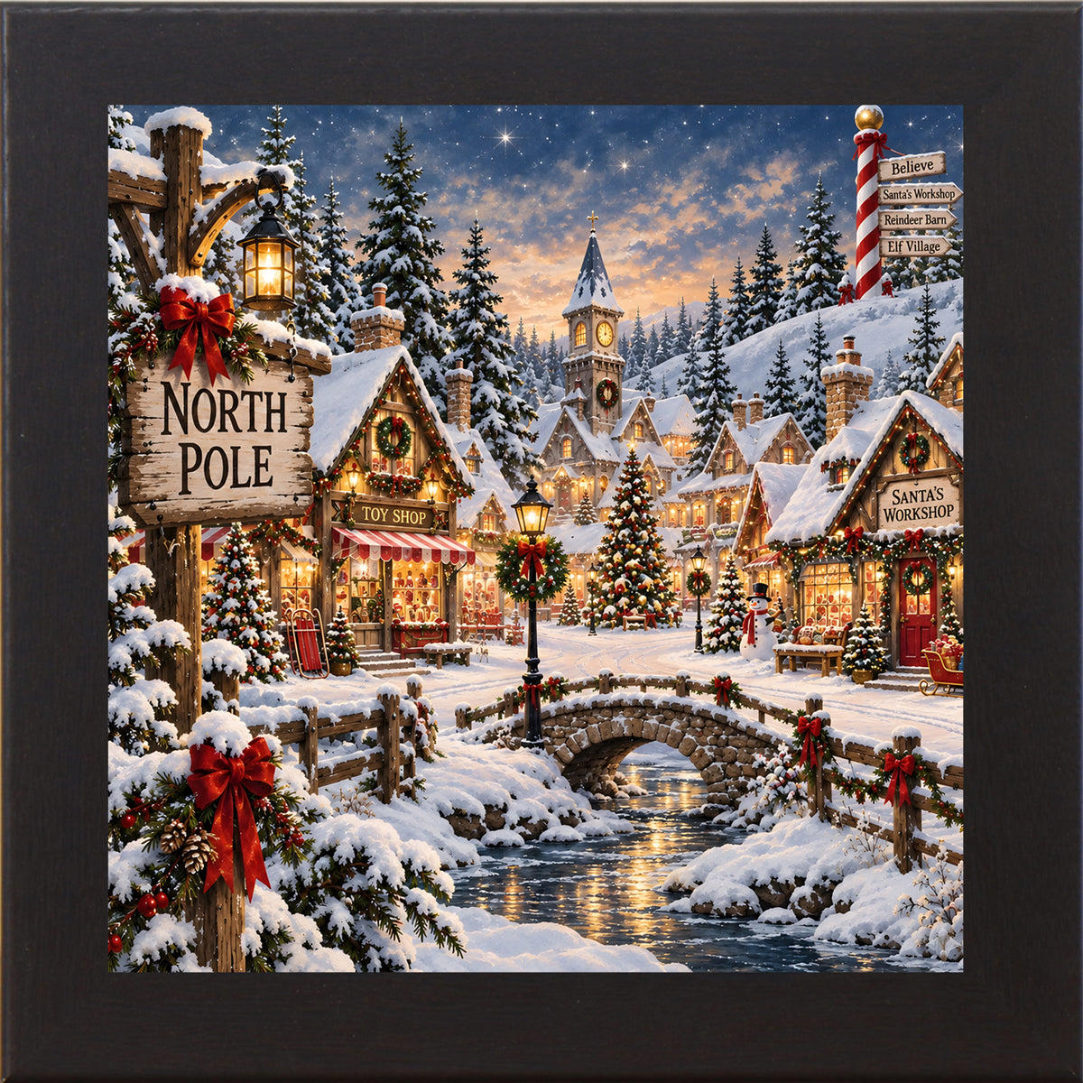 Black framed square North Pole village Christmas wall art with snow-covered shops, a clock tower, and a stone bridge at twilight