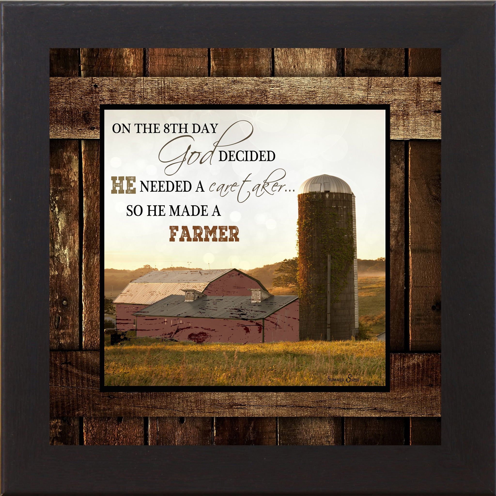 Black framed square farmhouse wall art with On The 8th Day God Made A Farmer quote over red barn and ivy silo at golden sunrise on rustic barn wood background