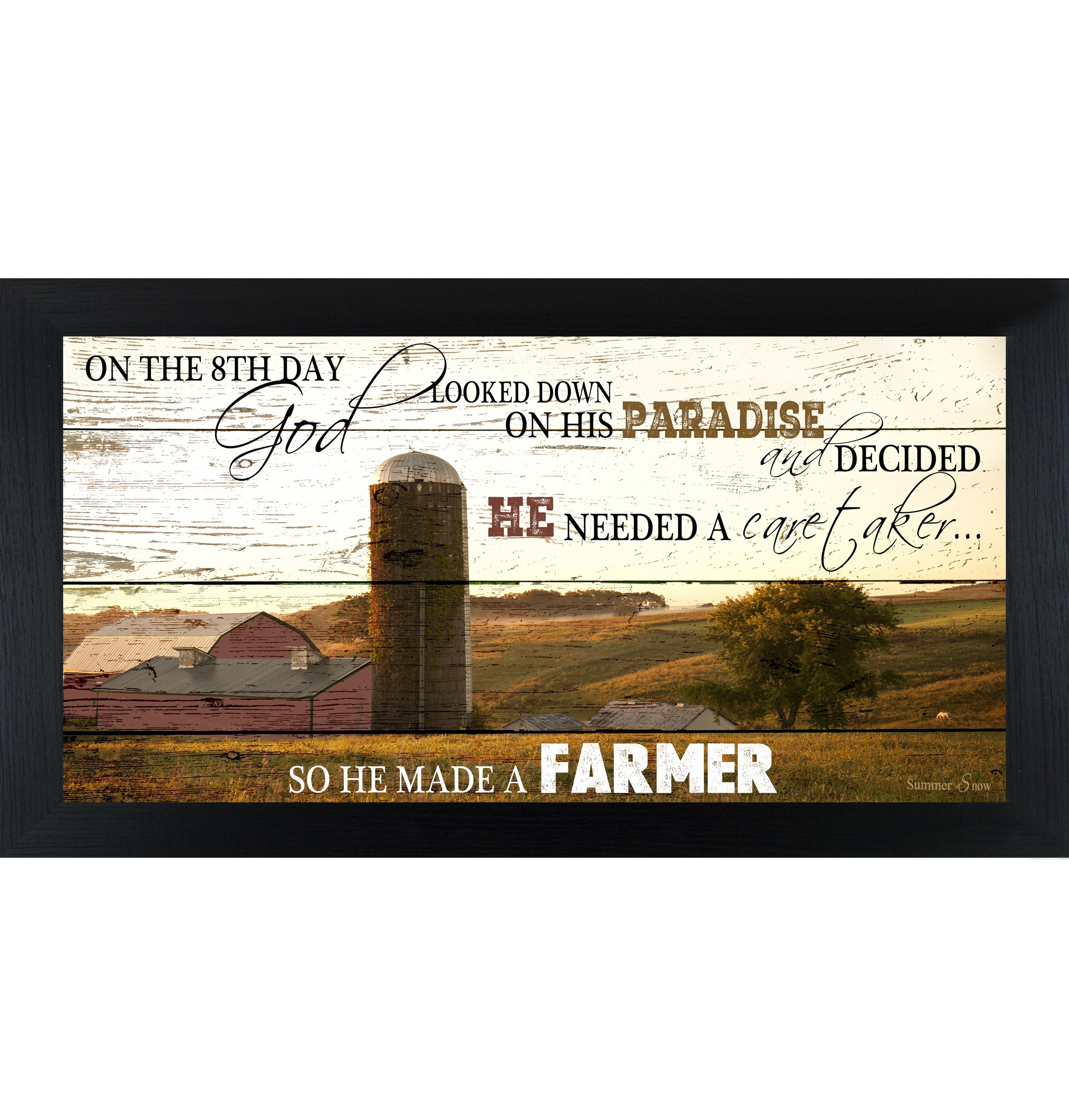 Black framed wide panoramic farmhouse wall art featuring a red barn and silo on pallet wood background with the full quote On The 8th Day God Looked Down On His Paradise And Decided He Needed A Caretaker So He Made A Farmer