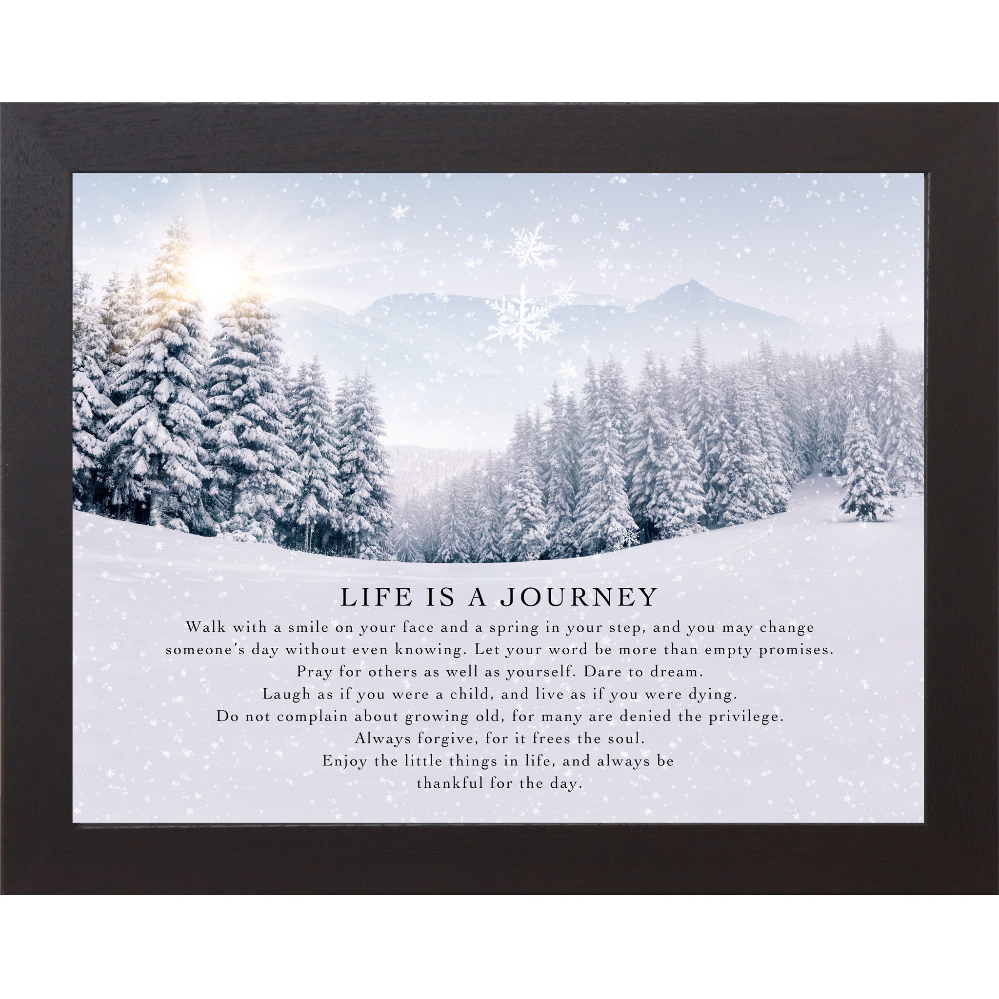 Black framed landscape winter wall art featuring a sunlit snowy pine forest with falling snowflakes and the words "Life Is A Journey" followed by an inspirational life philosophy