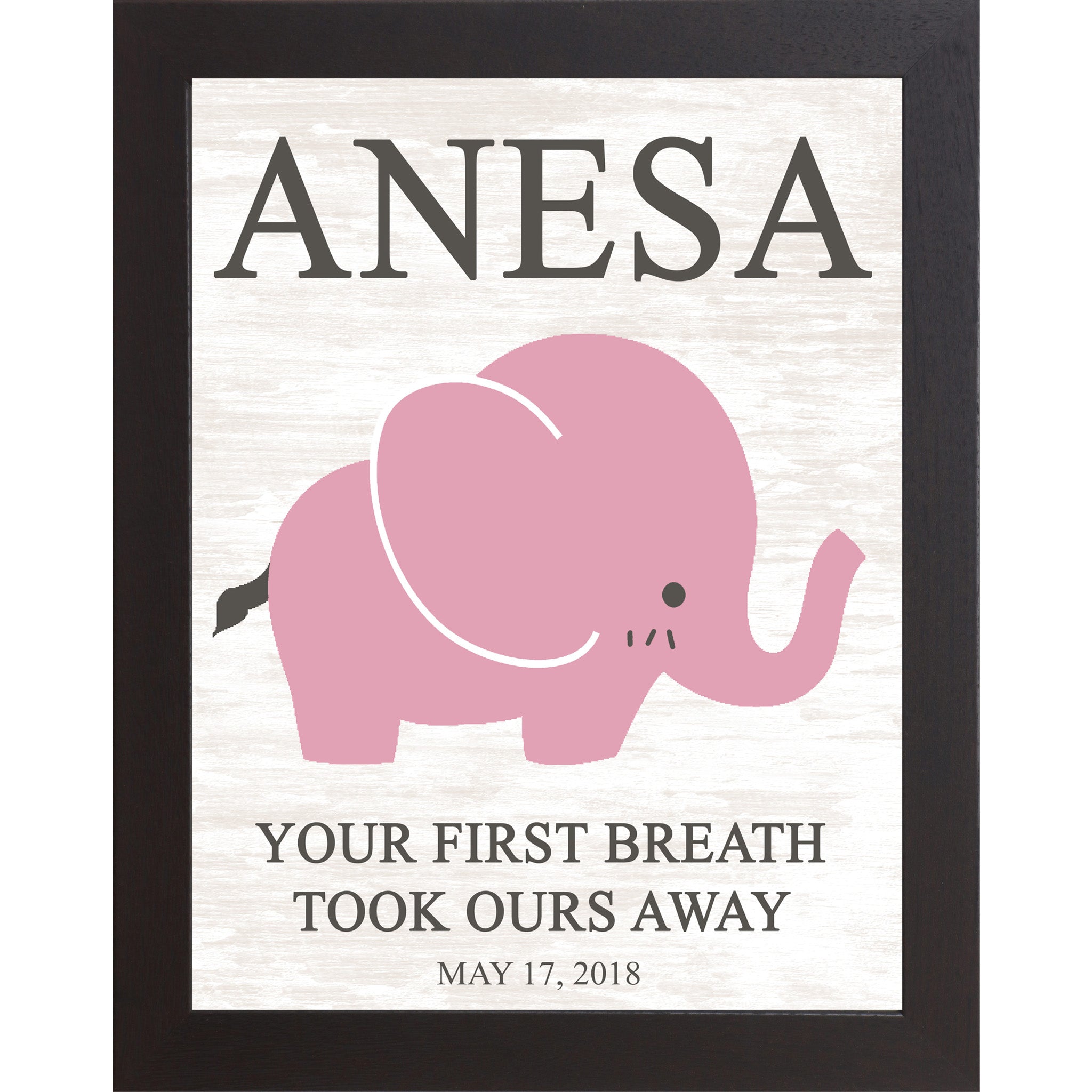 Black framed personalized pink elephant nursery wall art with bold baby name at top and the words Your First Breath Took Ours Away with birth date on soft white shiplap background — PER149