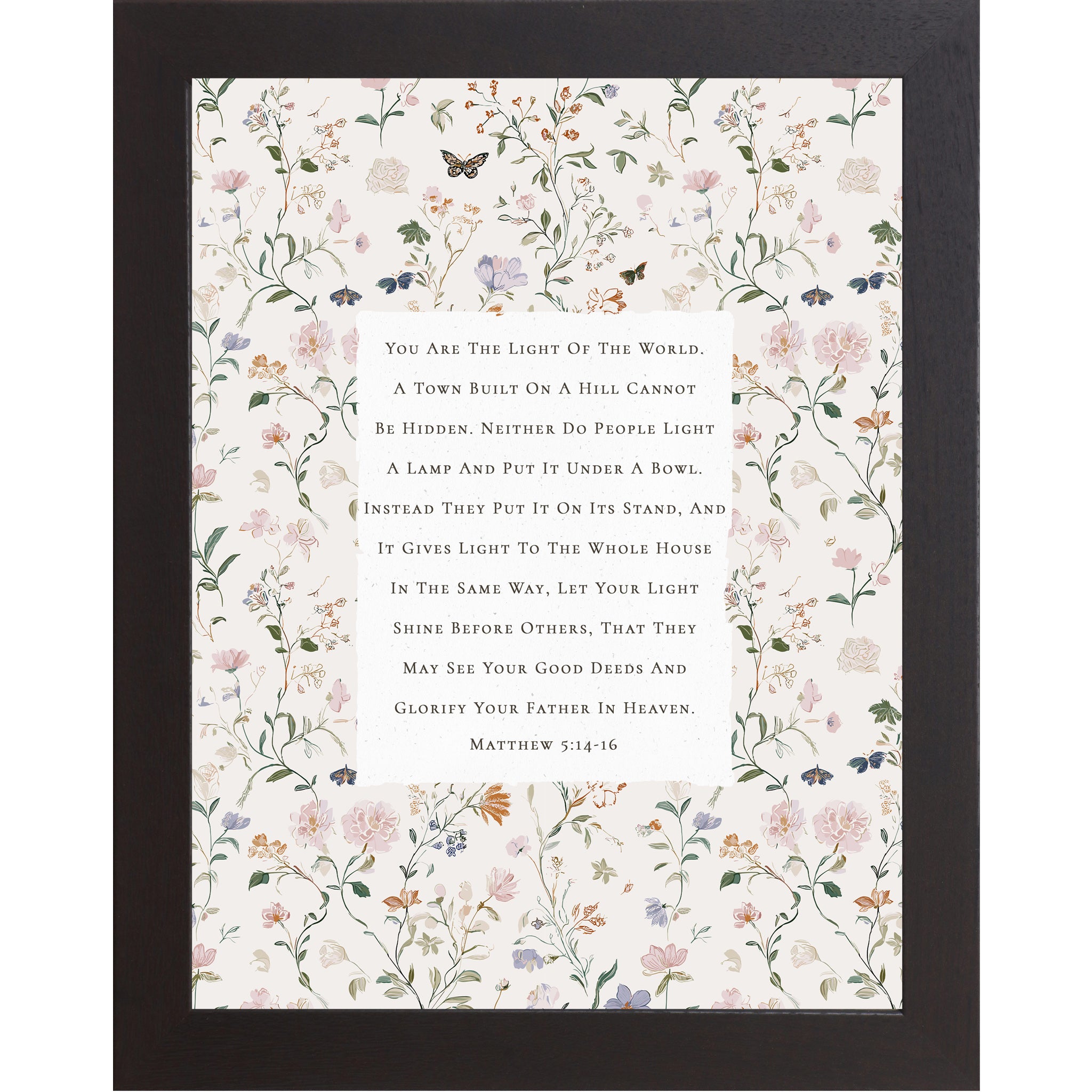 Vertical framed wall art featuring Matthew 5:14-16 Bible verse centered on a neutral background surrounded by soft pastel florals and butterflies, Christian scripture decor in 8x10 and larger sizes.