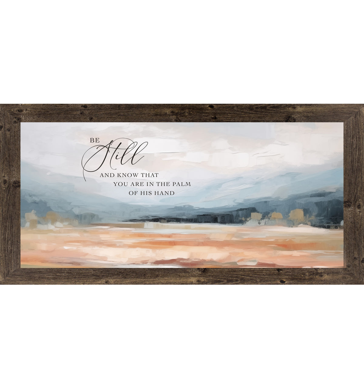Natural Brown framed wide landscape Christian wall art with Be Still And Know That You Are In The Palm Of His Hand scripture in oversized script over dramatic blue-grey mountains and soft peach blush terracotta field