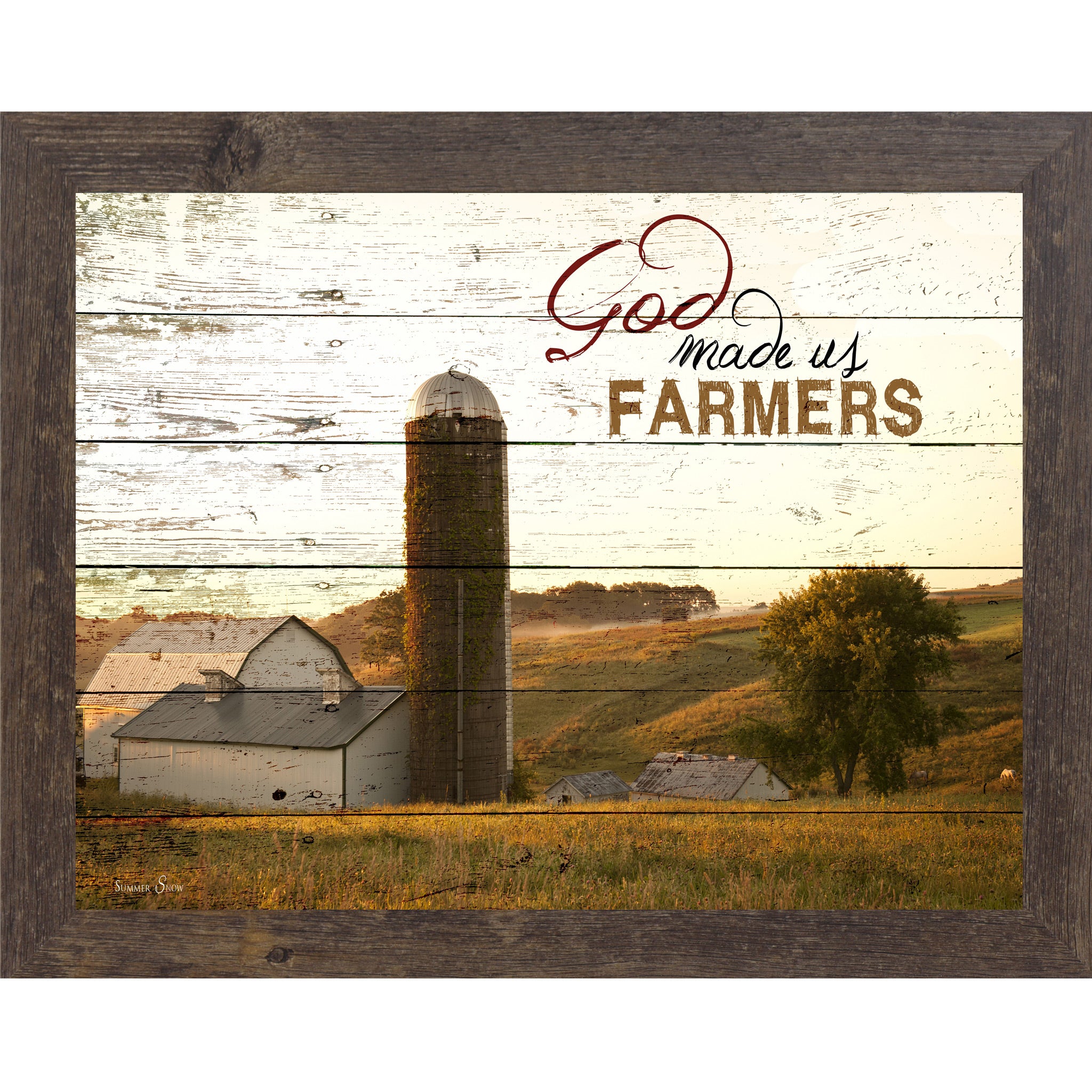 Natural Brown framed horizontal farmhouse landscape wall art featuring a white barn and silo on rolling green hills with pallet wood background and the words God Made Us Farmers