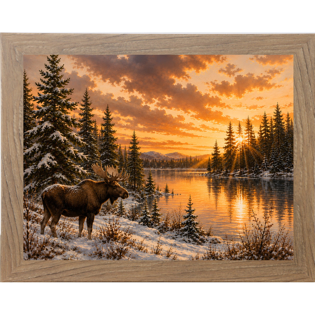 Farmtable framed landscape wall art featuring a moose standing along a sunlit snowy lakeshore at golden hour