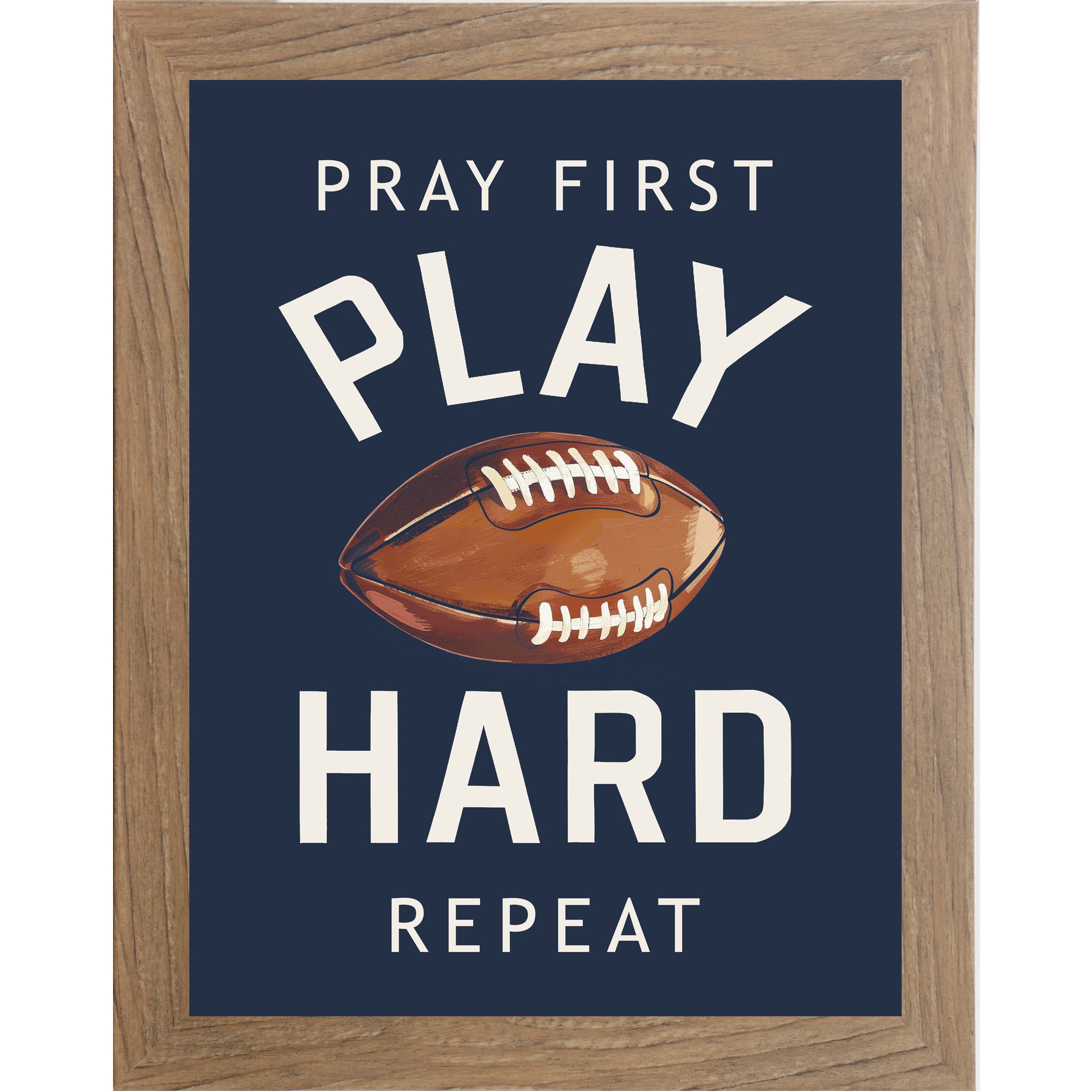 Farmtable framed portrait Christian football wall art on navy blue background with bold cream varsity typography and vivid watercolor football with the words Pray First Play Hard Repeat — SB260