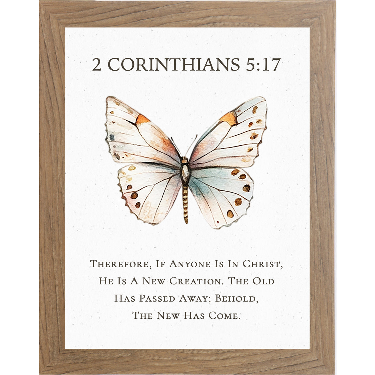 2 Corinthians 5:17 Christian butterfly wall art featuring a large watercolor butterfly on a neutral white background, framed scripture decor symbolizing new creation in Christ.
