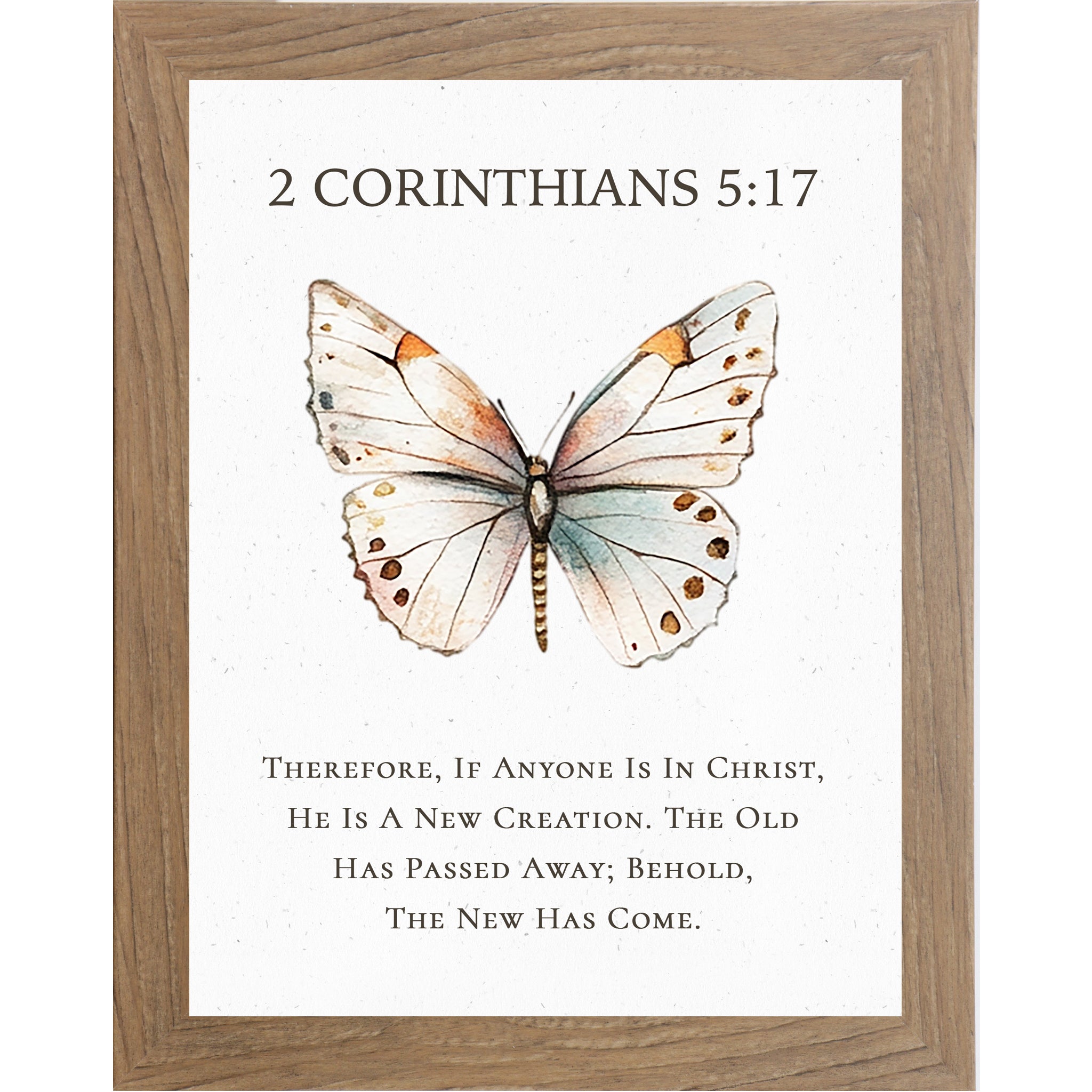 2 Corinthians 5:17 Christian butterfly wall art featuring a large watercolor butterfly on a neutral white background, framed scripture decor symbolizing new creation in Christ.