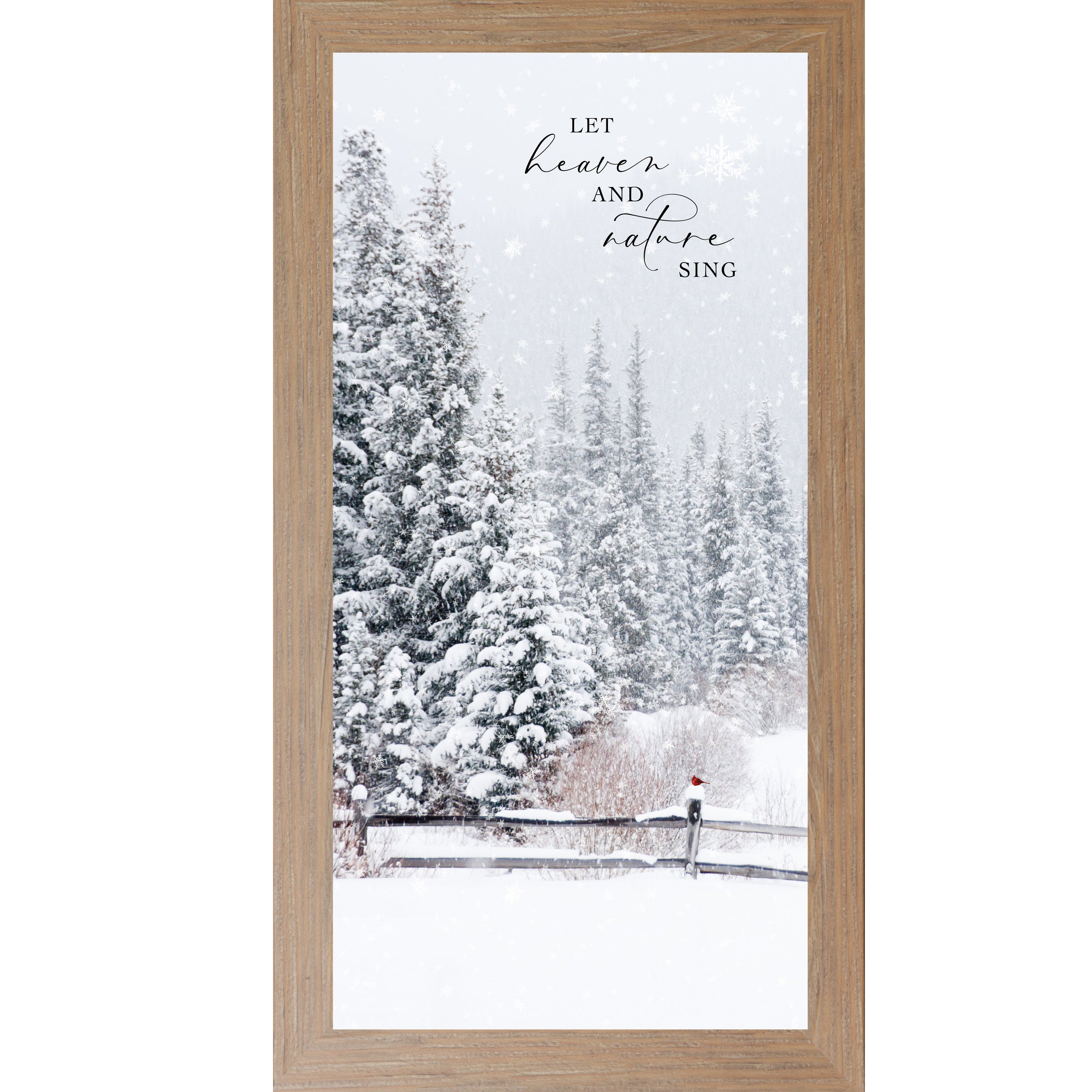 Framed winter wall art with the words “Let Heaven and Nature Sing,” featuring a snowy evergreen forest, rustic fence, falling snow, and a red cardinal perched on a fence post.