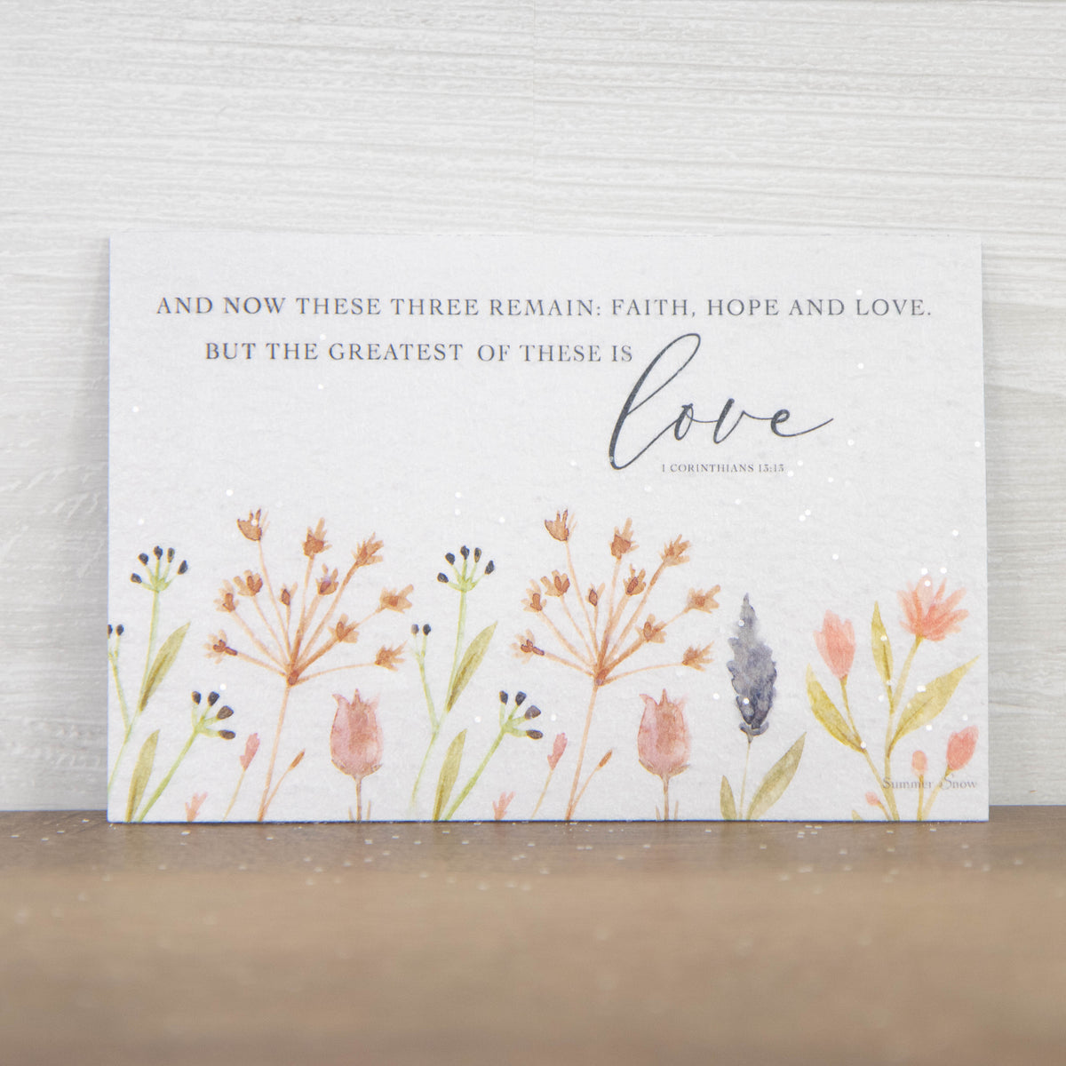Christian scripture magnet featuring Corinthians 13:13 with faith hope and love quote, simple floral design on neutral white background with subtle glitter finish