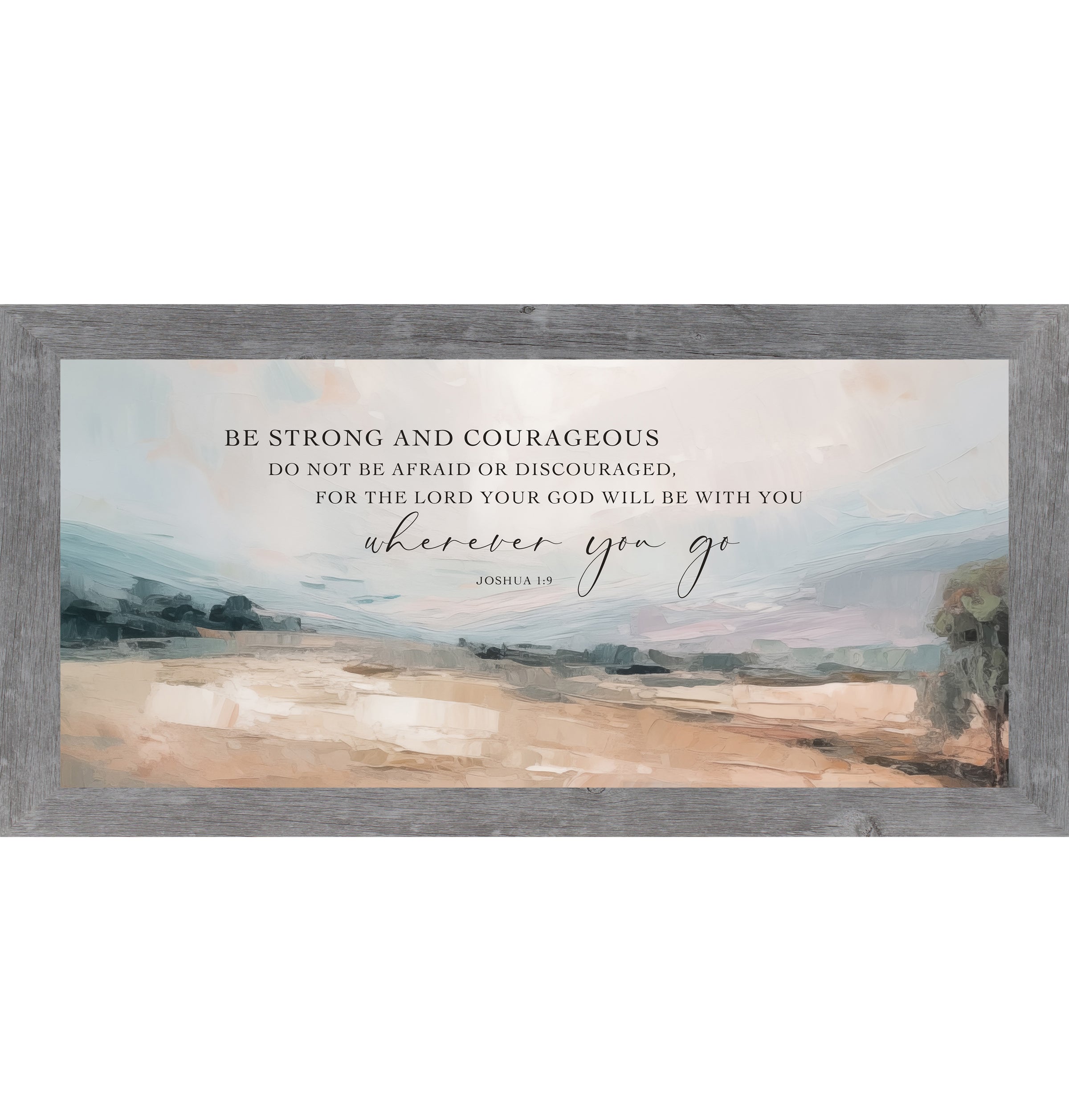 Gray framed wide landscape Christian wall art with Be Strong and Courageous Joshua 1:9 scripture in elegant script over soft peach blue-grey sky and warm terracotta field with single tree right edge