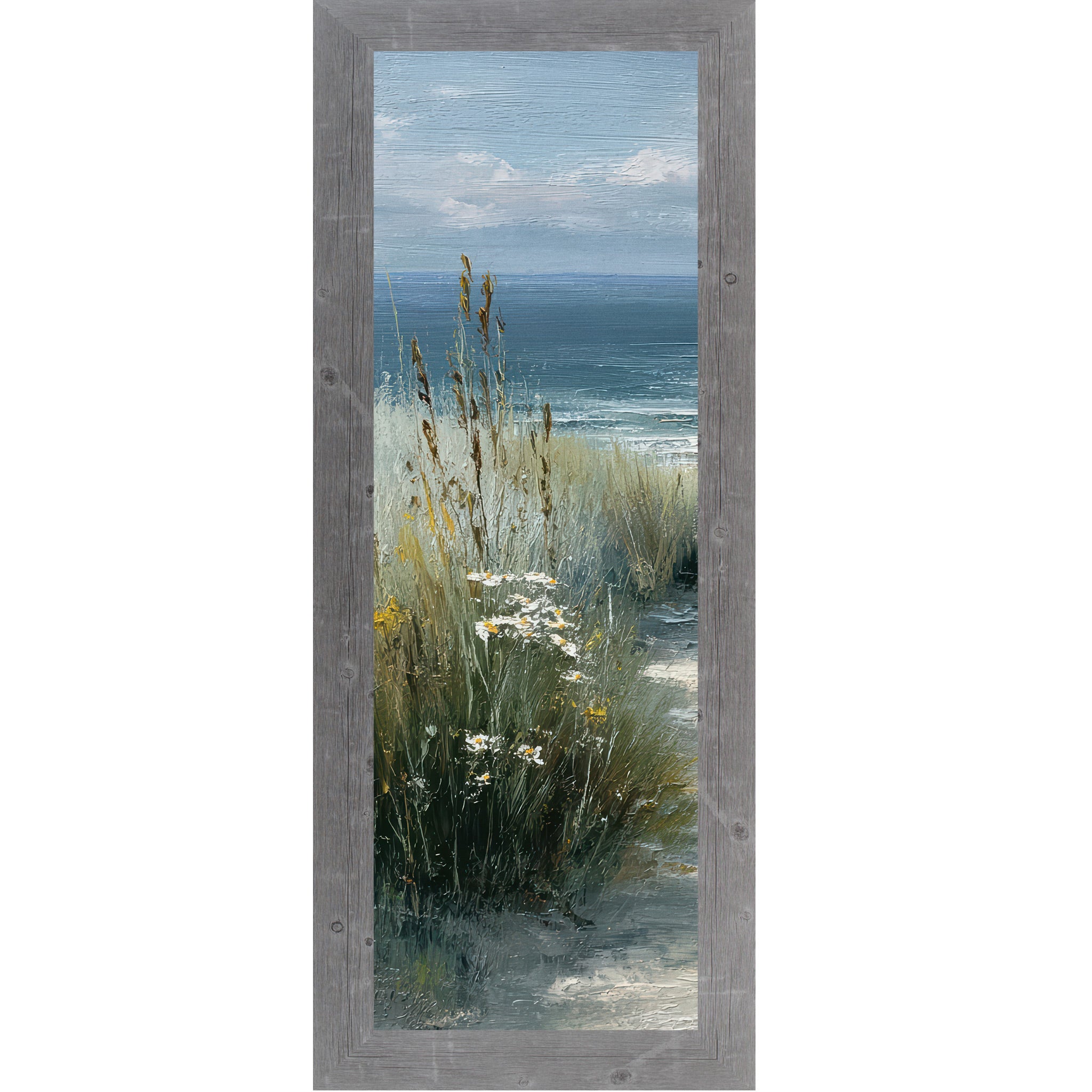 Gray framed narrow portrait coastal path left panel wall art featuring tall golden cattails and sea grasses with white daisies and yellow wildflowers and deep teal ocean in the distance