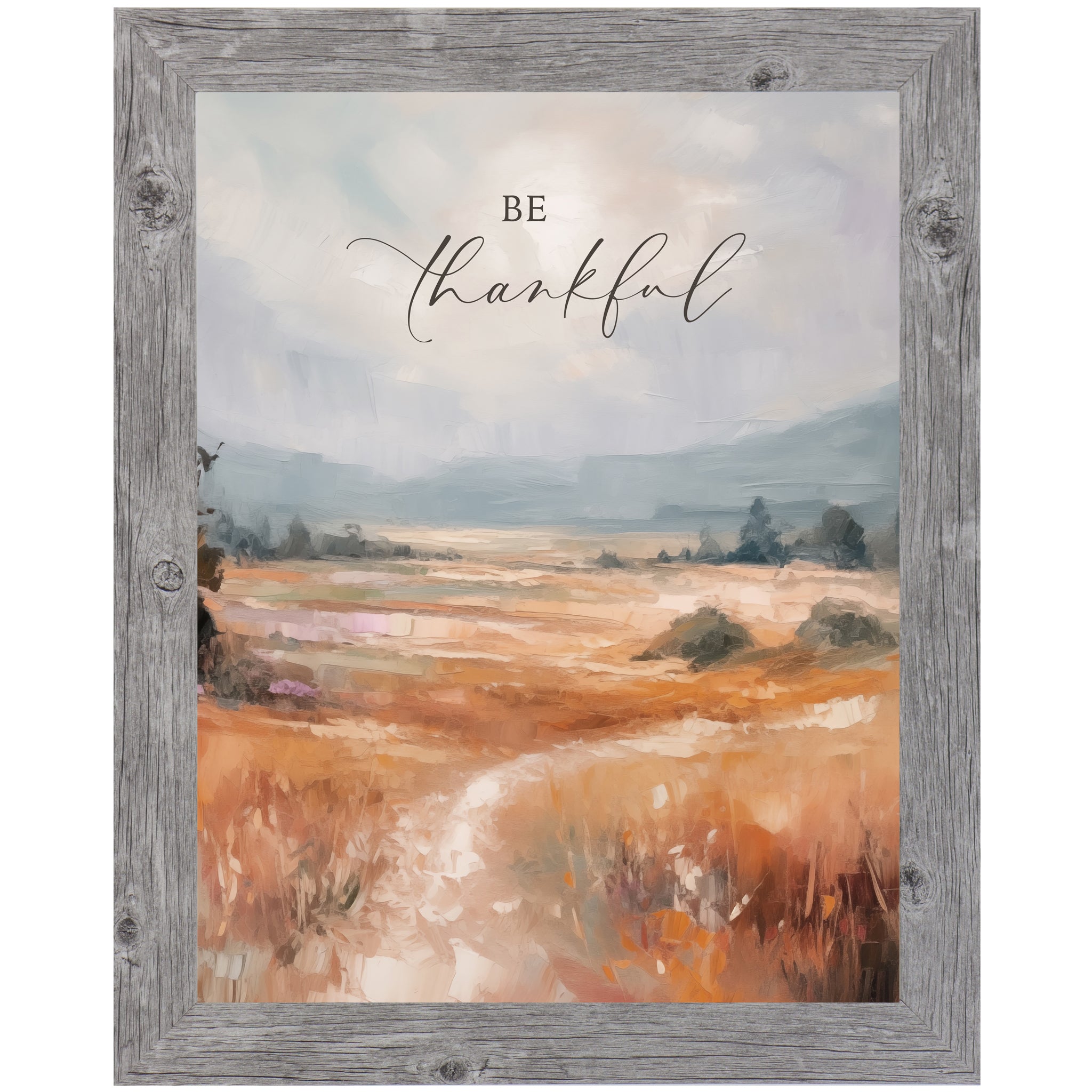 Gray framed portrait inspirational wall art with Be Thankful in elegant script over soft peach blush terracotta abstract painterly landscape with pale blue-grey sky