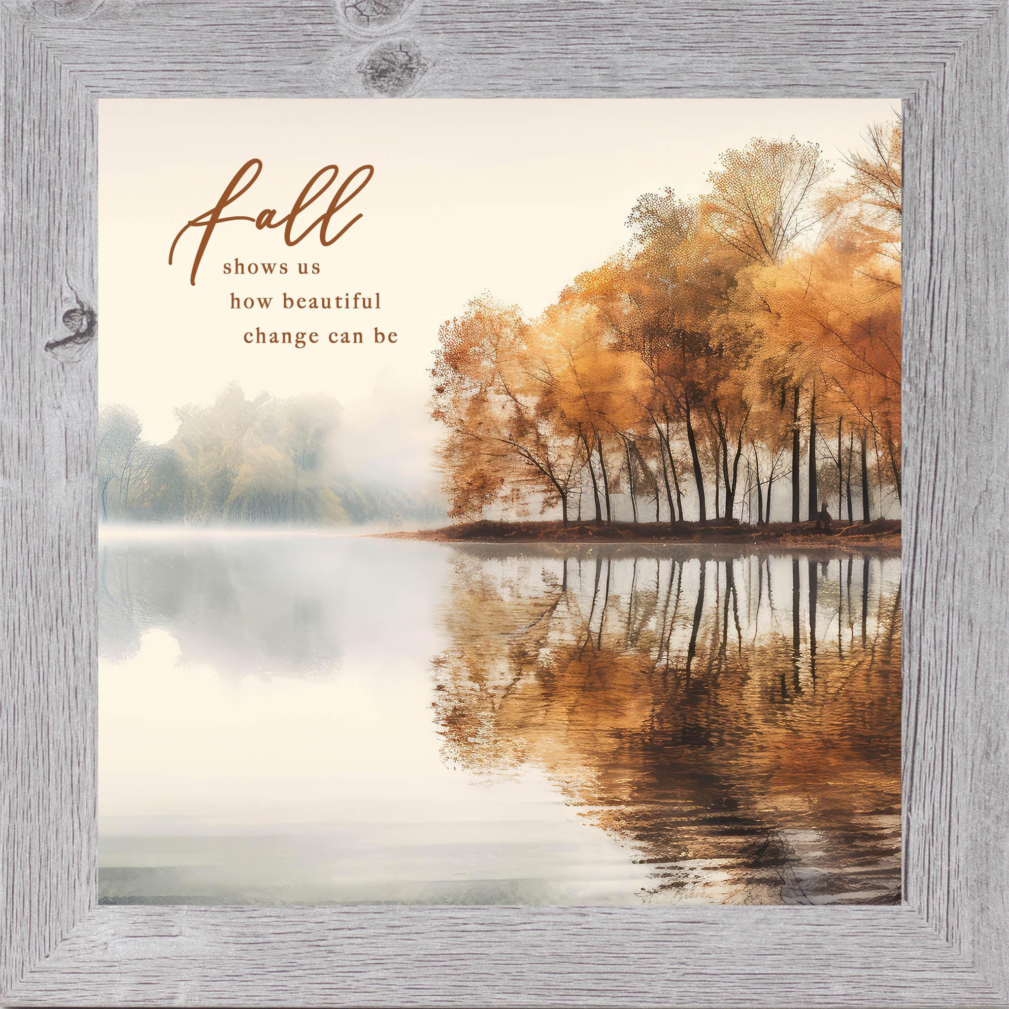 Gray framed square fall wall art featuring a misty autumn lake with golden amber trees and their reflection in still water with the words "Fall Shows Us How Beautiful Change Can Be"