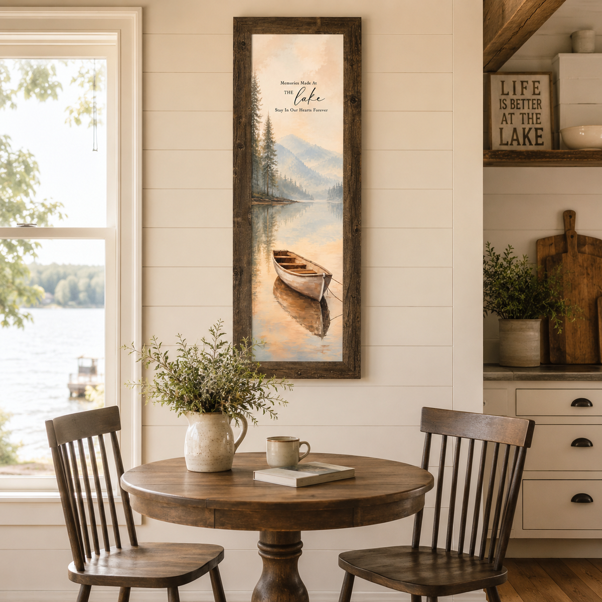 Natural Brown framed tall narrow portrait lake house wall art featuring Memories Made At The Lake watercolor rowboat displayed as a 14x40 statement piece in a lake house kitchen dining area with shiplap walls round farmhouse table and actual lake view through window