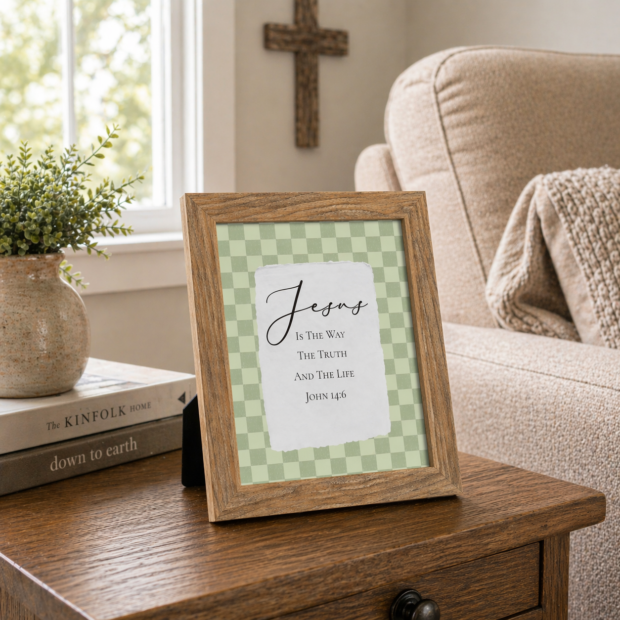 Living Room showing a beautiful farmtable framed Farmtable framed portrait Christian wall art with sage green checkered background and torn-edge white center panel with Jesus Is The Way The Truth And The Life John 14:6 in elegant script with an easel back attached to it as a 8x10