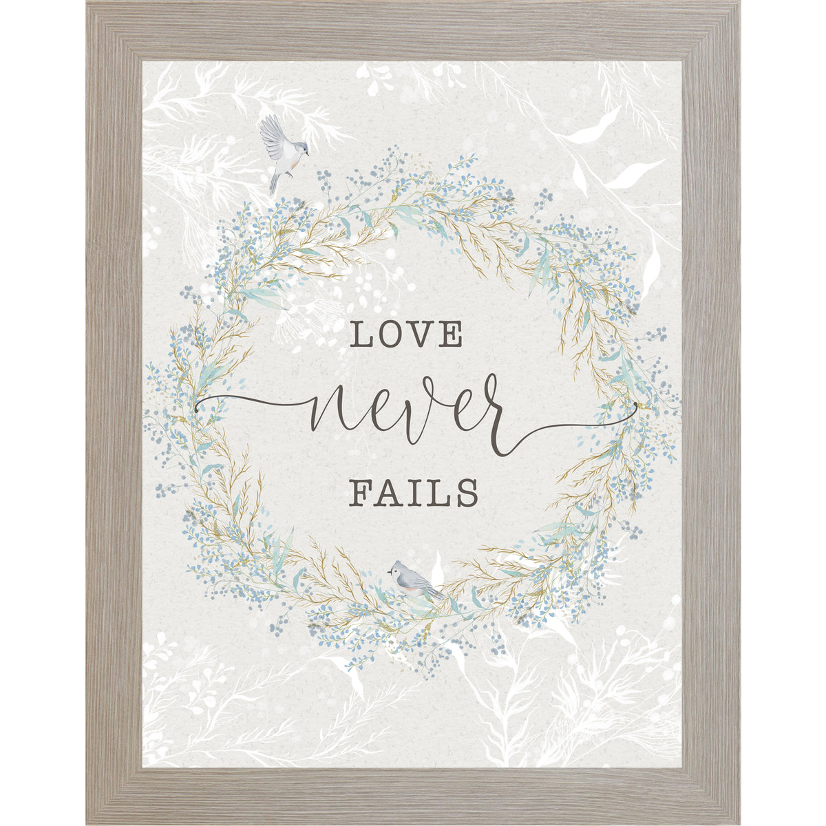Floral wreath wall art with the words “Love Never Fails” on a soft neutral background.
