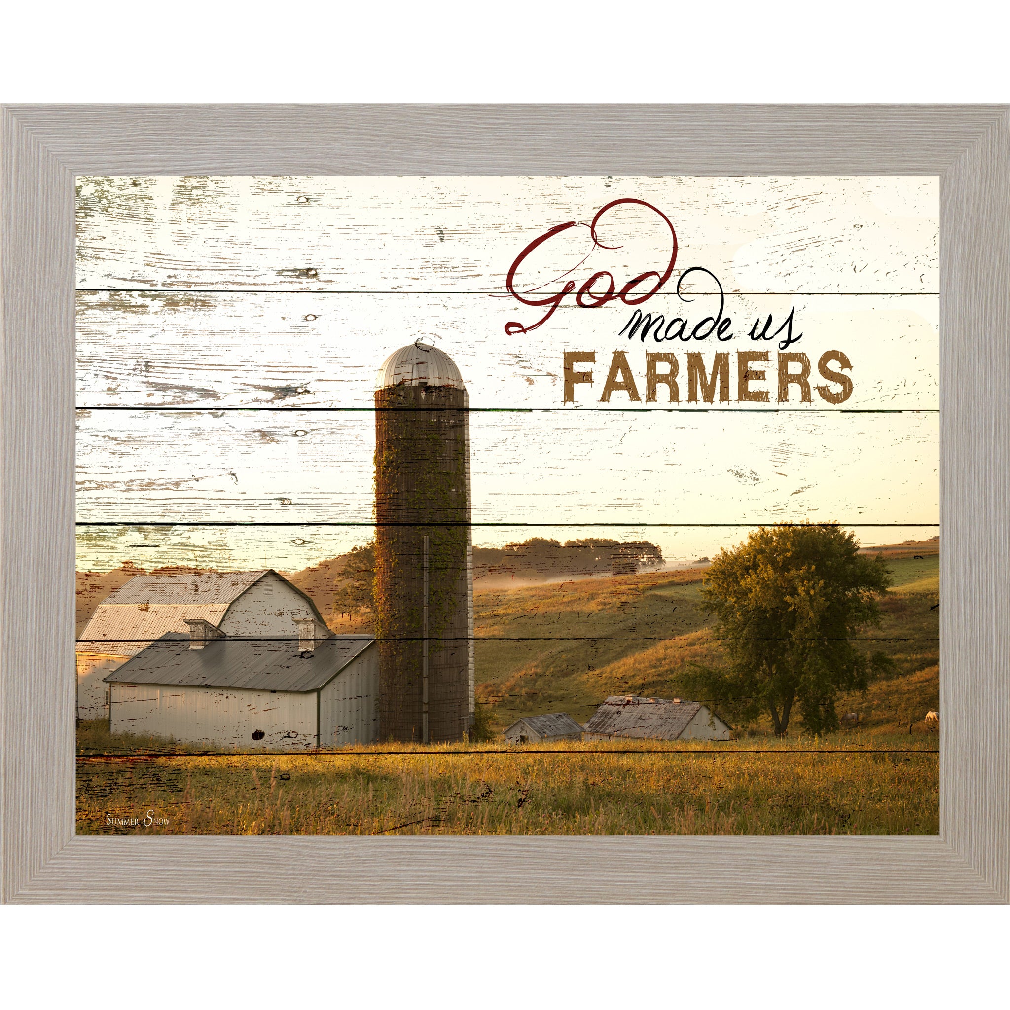 Monte Carlo framed horizontal farmhouse landscape wall art featuring a white barn and silo on rolling green hills with pallet wood background and the words God Made Us Farmers