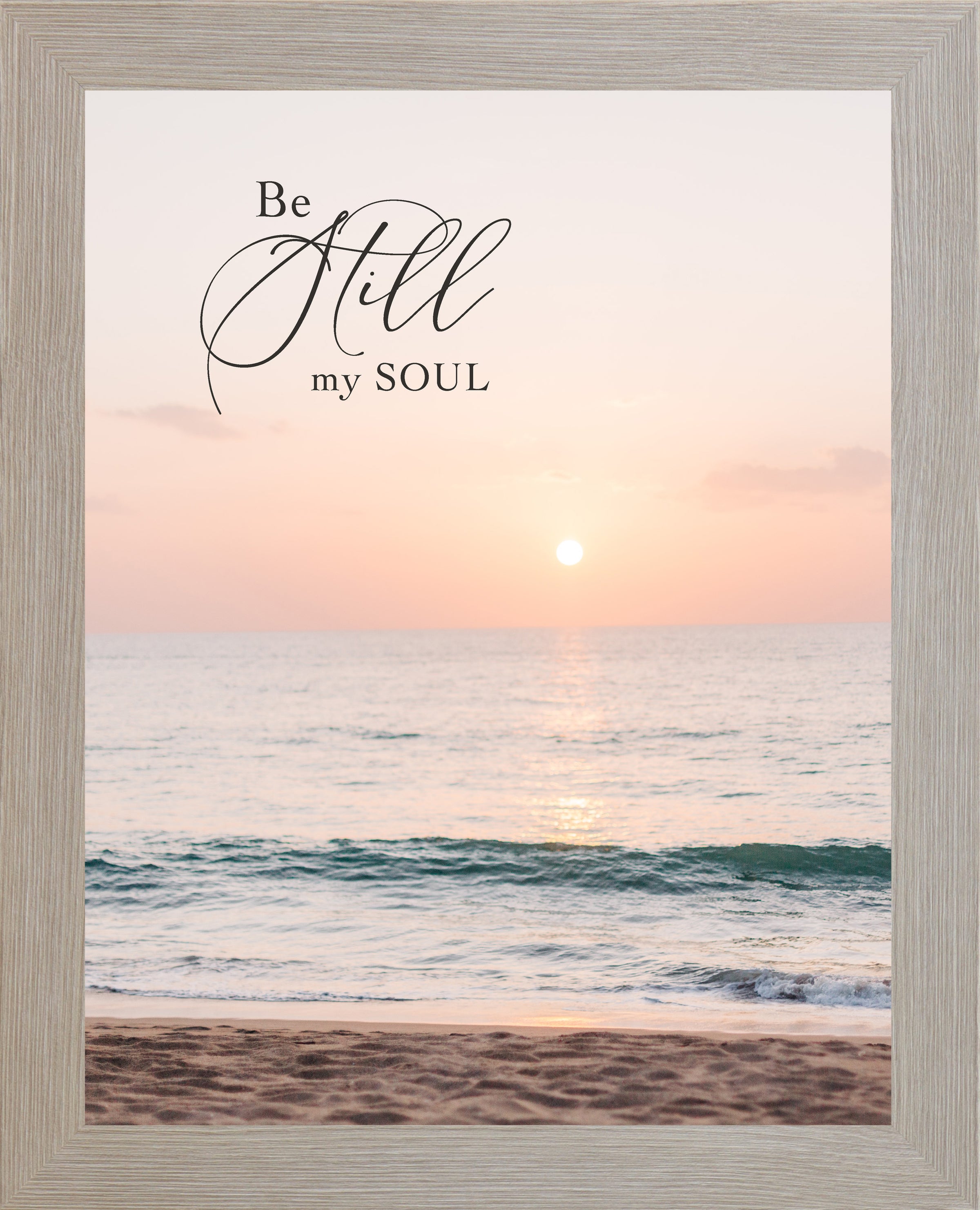 Monte Carlo framed portrait Christian wall art with the words Be Still My Soul in elegant script set against a soft peach and coral beach sunset with teal ocean waves and sandy shoreline