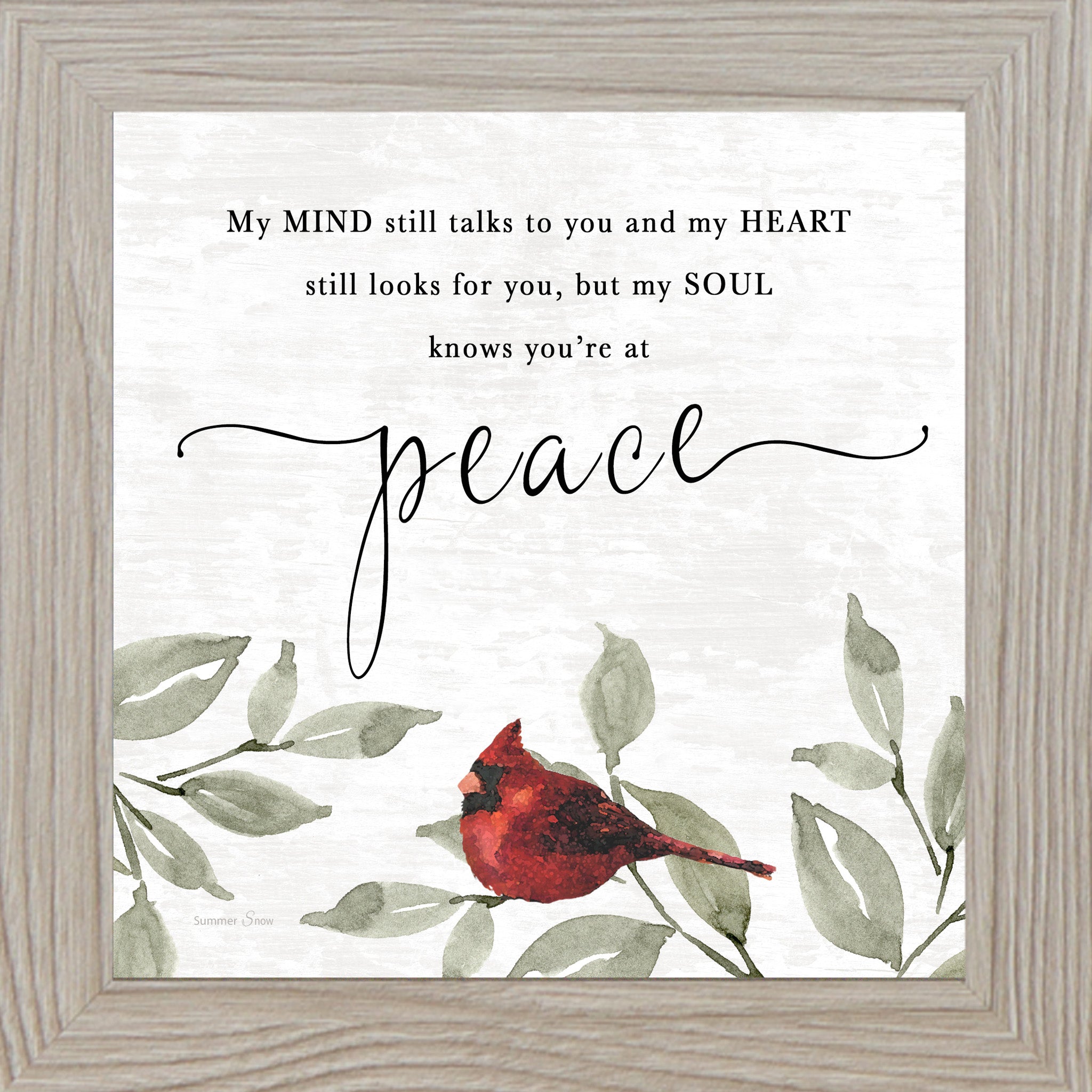 Framed sympathy wall art with a watercolor cardinal perched on green leaves and the quote “My soul knows you’re at peace,” displayed on a soft neutral textured background.
