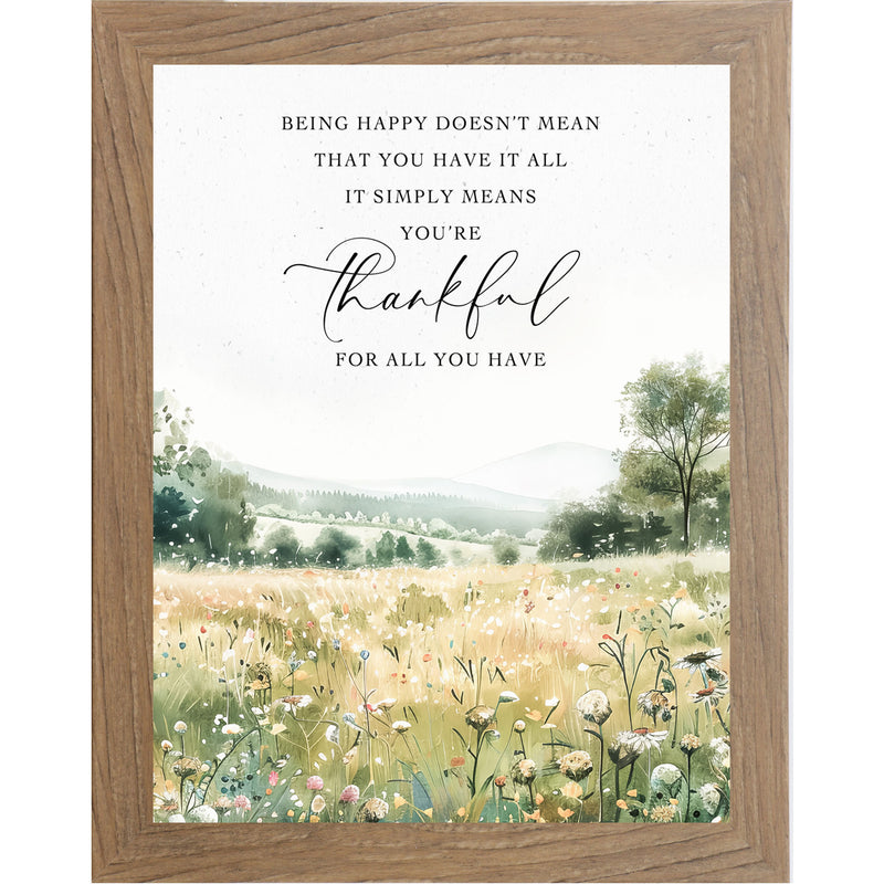 Framed watercolor wall art with field of spring flowers, green hills, and quote about being happy and grateful