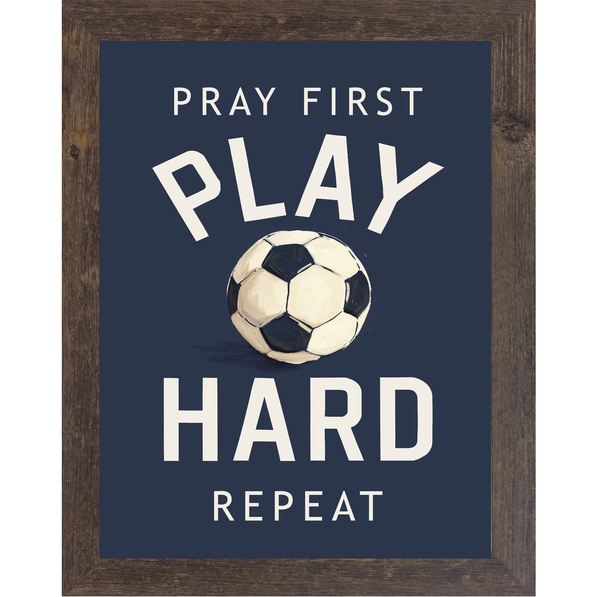 Natural brown framed portrait Christian soccer wall art on navy blue background with bold cream varsity typography and vivid watercolor soccer ball with the words Pray First Play Hard Repeat — SB261