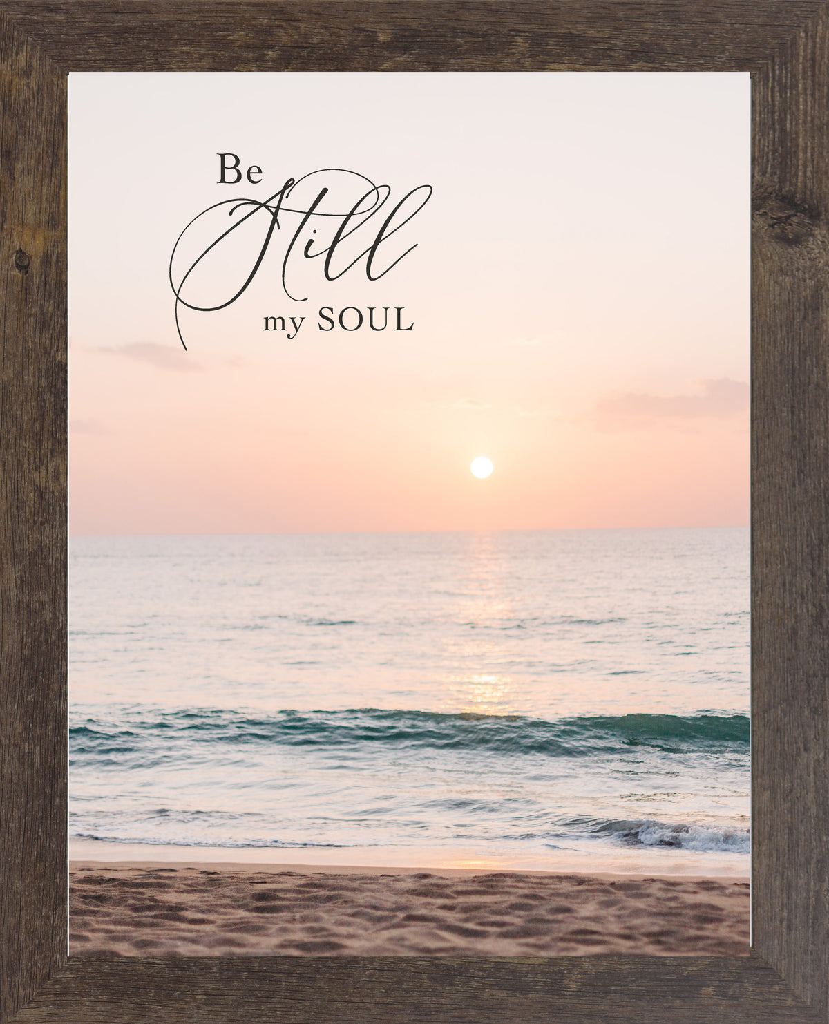 Natural brown framed portrait Christian wall art with the words Be Still My Soul in elegant script set against a soft peach and coral beach sunset with teal ocean waves and sandy shoreline