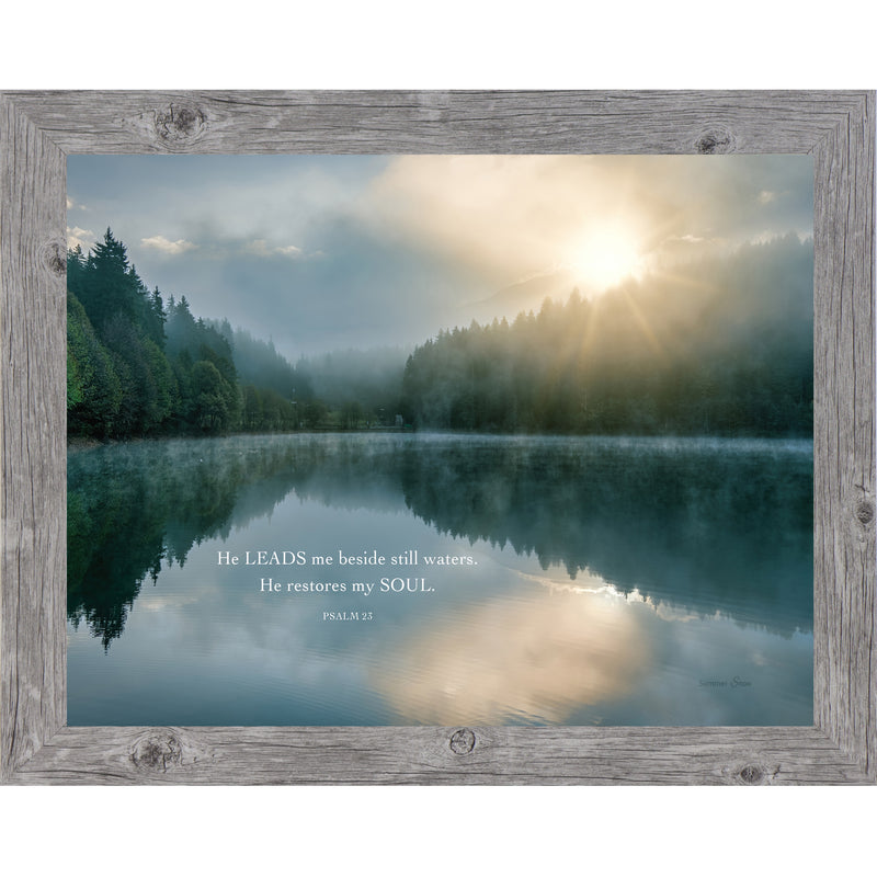Framed Psalm 23 wall art with sunrise over a calm lake, fog, trees, and quote “He leads me beside still waters, He restores my soul”