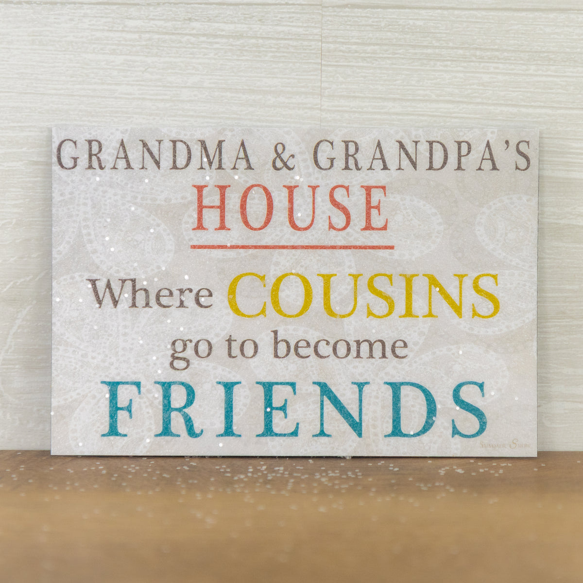 Grandma & Grandpa’s House magnet – 4x6 horizontal colorful text on neutral gray-brown swirled background, glittered acrylic finish