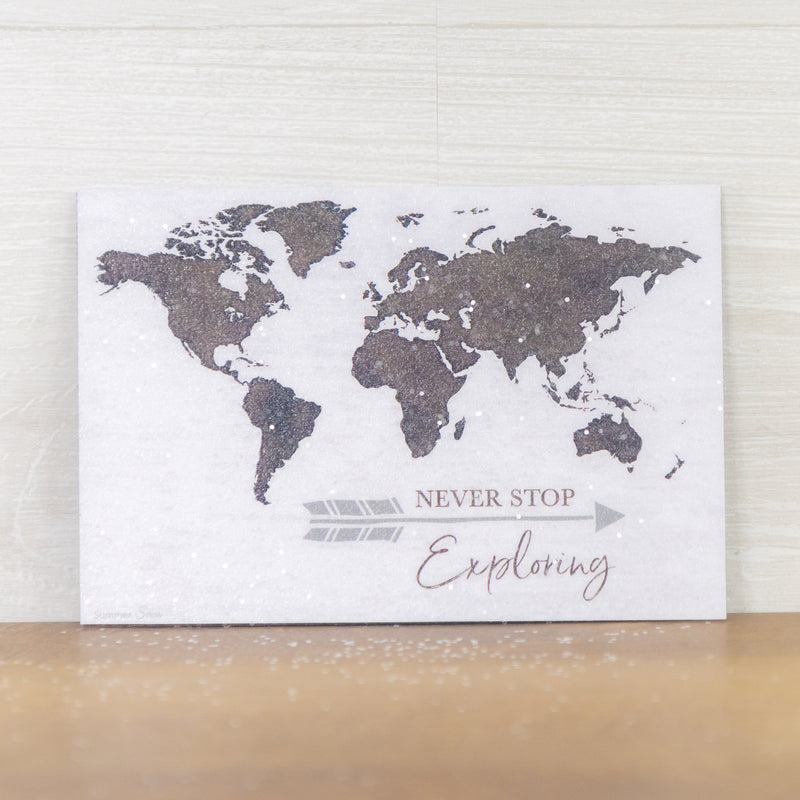 Never Stop Exploring magnet – 4x6 horizontal world map in brown on white with arrow and inspirational quote, glittered acrylic finish