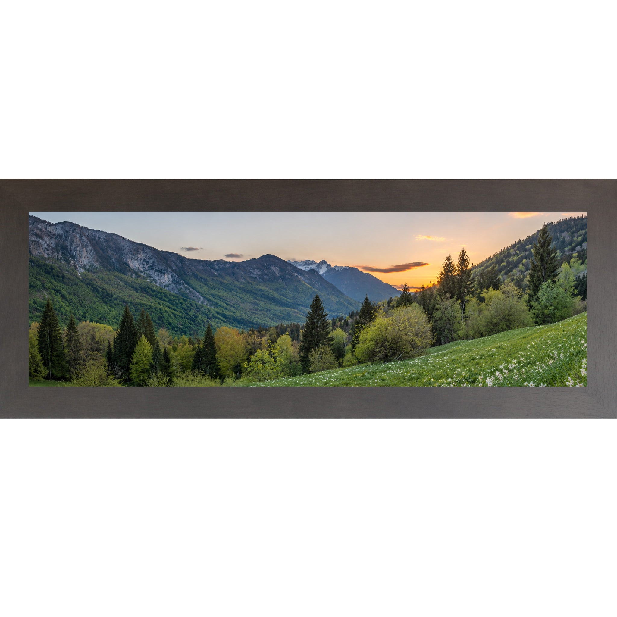 Slatewood framed wide panoramic nature wall art featuring a mountain valley at sunset with snow-capped peaks evergreen forest and white wildflower meadow in the foreground