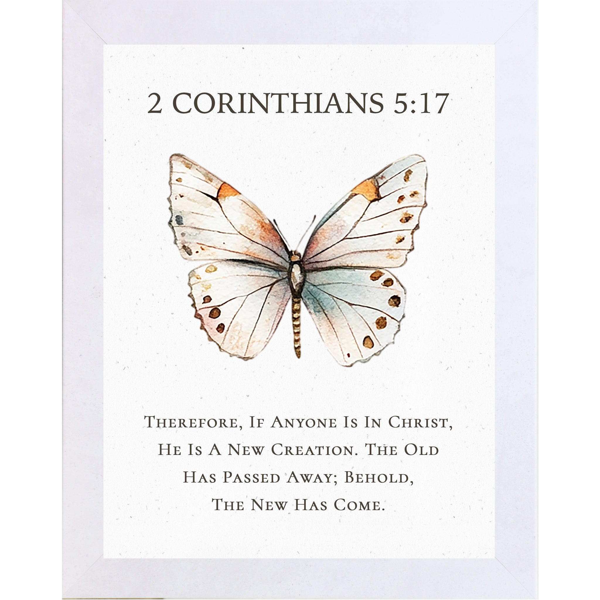 2 Corinthians 5:17 Christian butterfly wall art featuring a large watercolor butterfly on a neutral white background, framed scripture decor symbolizing new creation in Christ.