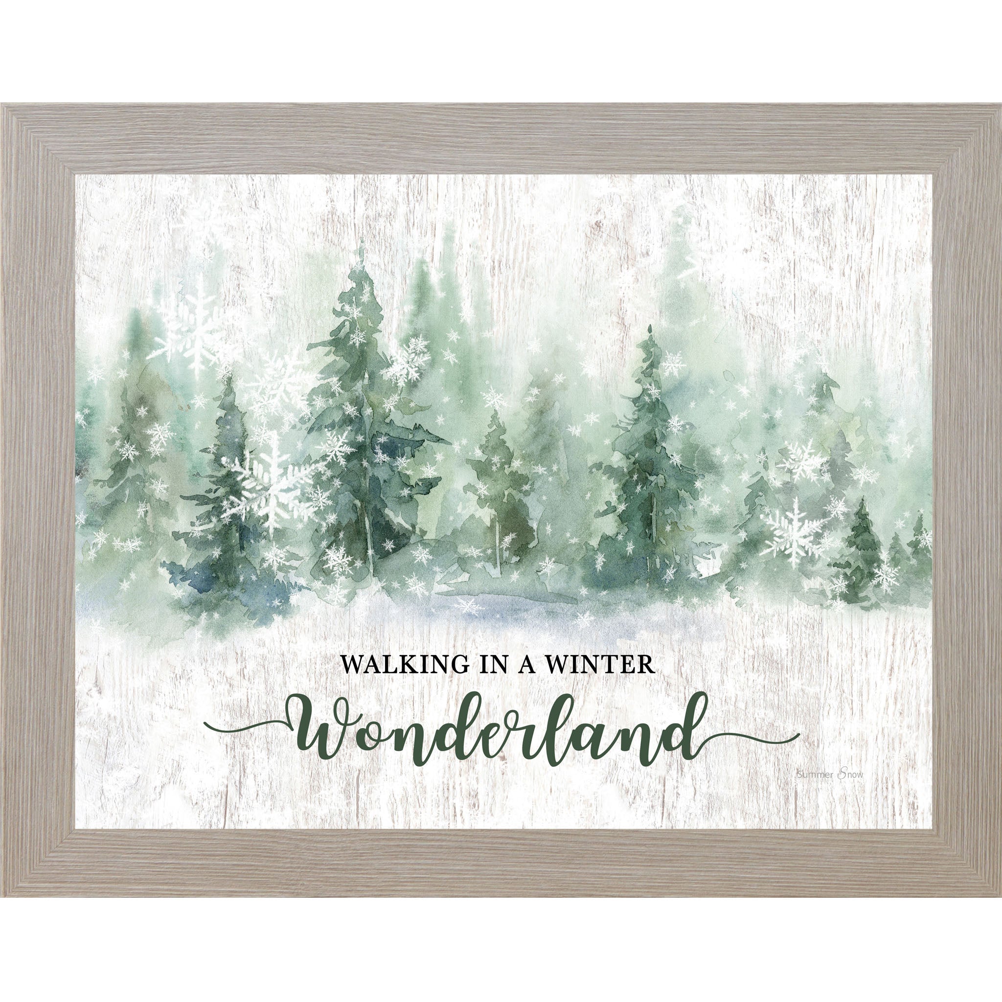 Framed winter wall art featuring watercolor evergreen trees and snowflakes across a white slatted wood background with the words Walking in a Winter Wonderland