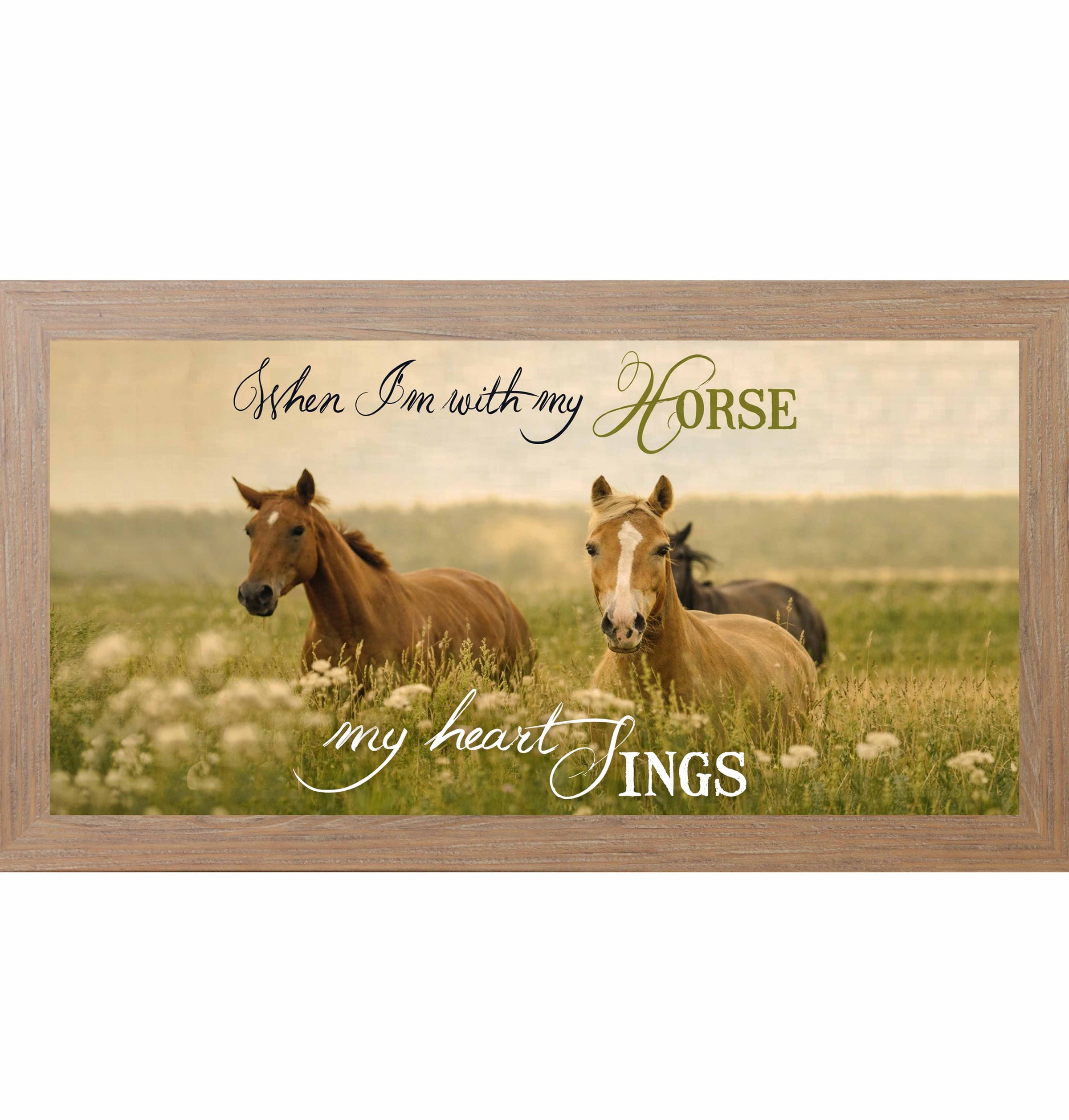 Wide framed horse wall art featuring horses standing in a grassy field with the quote “When I’m With My Horse My Heart Sings” in soft handwritten lettering.