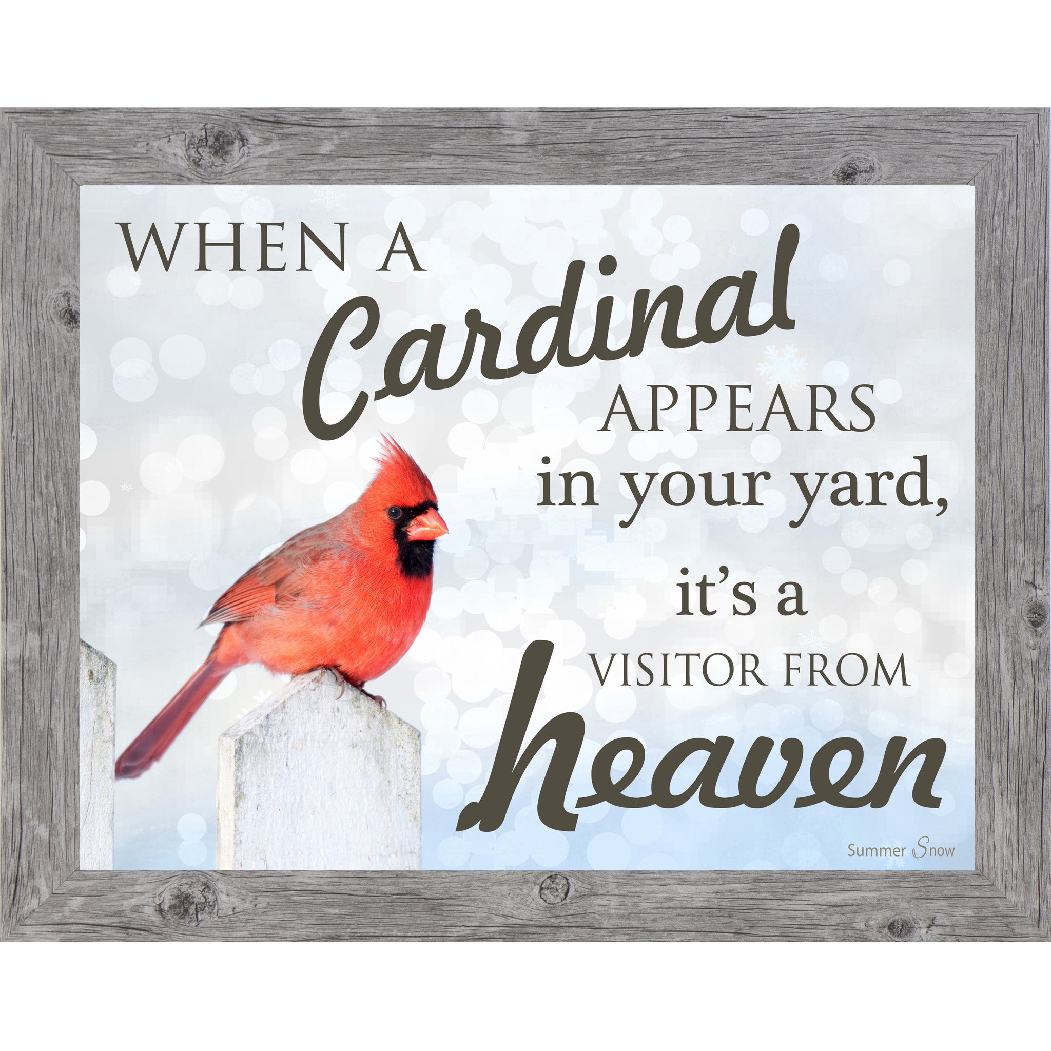 Vertical framed wall art featuring a red cardinal on a white fence with a soft blue background and the words When a Cardinal Appears in Your Yard