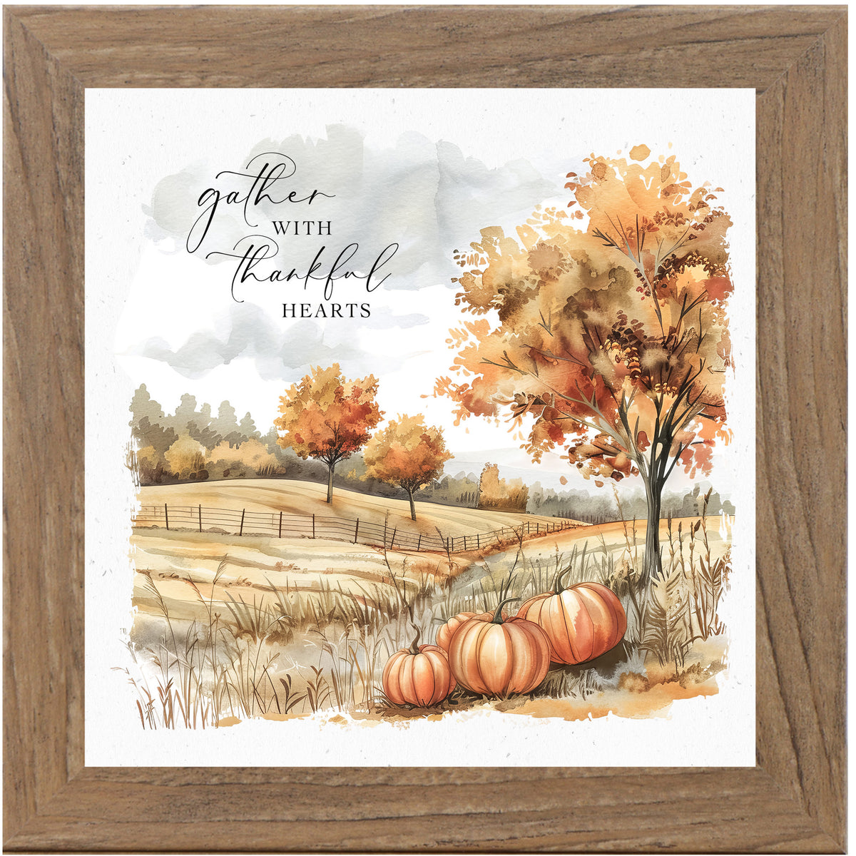 Framed fall art with pumpkins in a brown farm field, turning trees, and the quote “Gather With Thankful Hearts” in warm watercolor tones