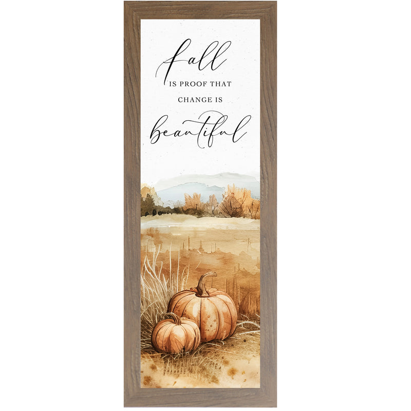 Framed fall wall art with pumpkins in a brown field, autumn trees, and a mountain in the background – features quote “Fall is proof that change is beautiful”