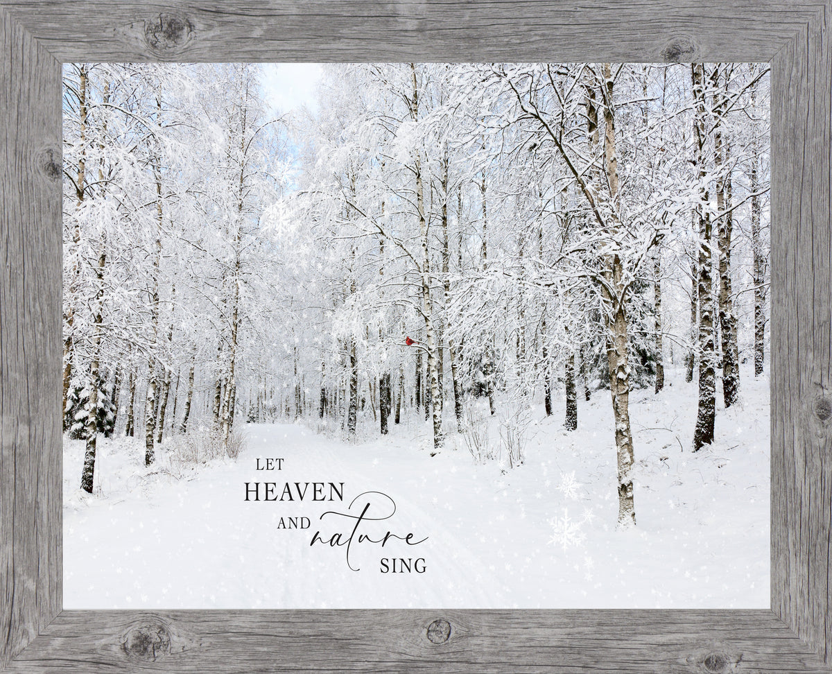 Framed winter forest wall art with snow-covered trees, red cardinals, and the quote “Let Heaven and Nature Sing”