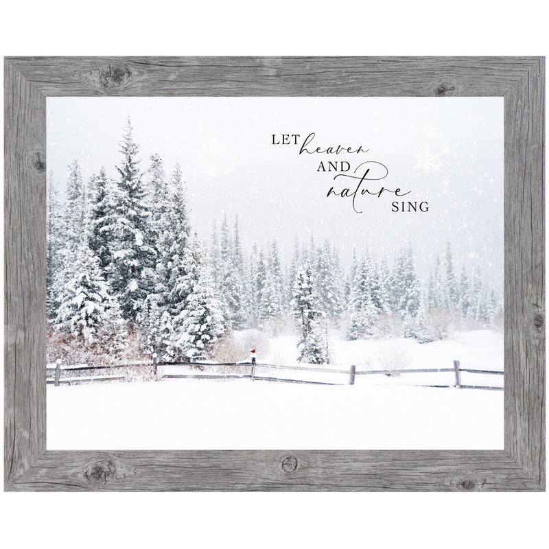 Framed winter wall art with red cardinal on snowy fence, falling snow, and phrase “Let Heaven and Nature Sing” with evergreen woods in background