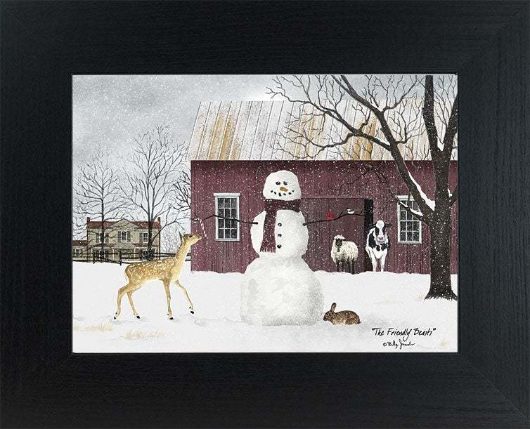 Framed winter farm wall art by Billy Jacobs showing a red barn, snowman with a red bird, and friendly farm animals including a cow, sheep, deer, and rabbit in a snowy landscape.